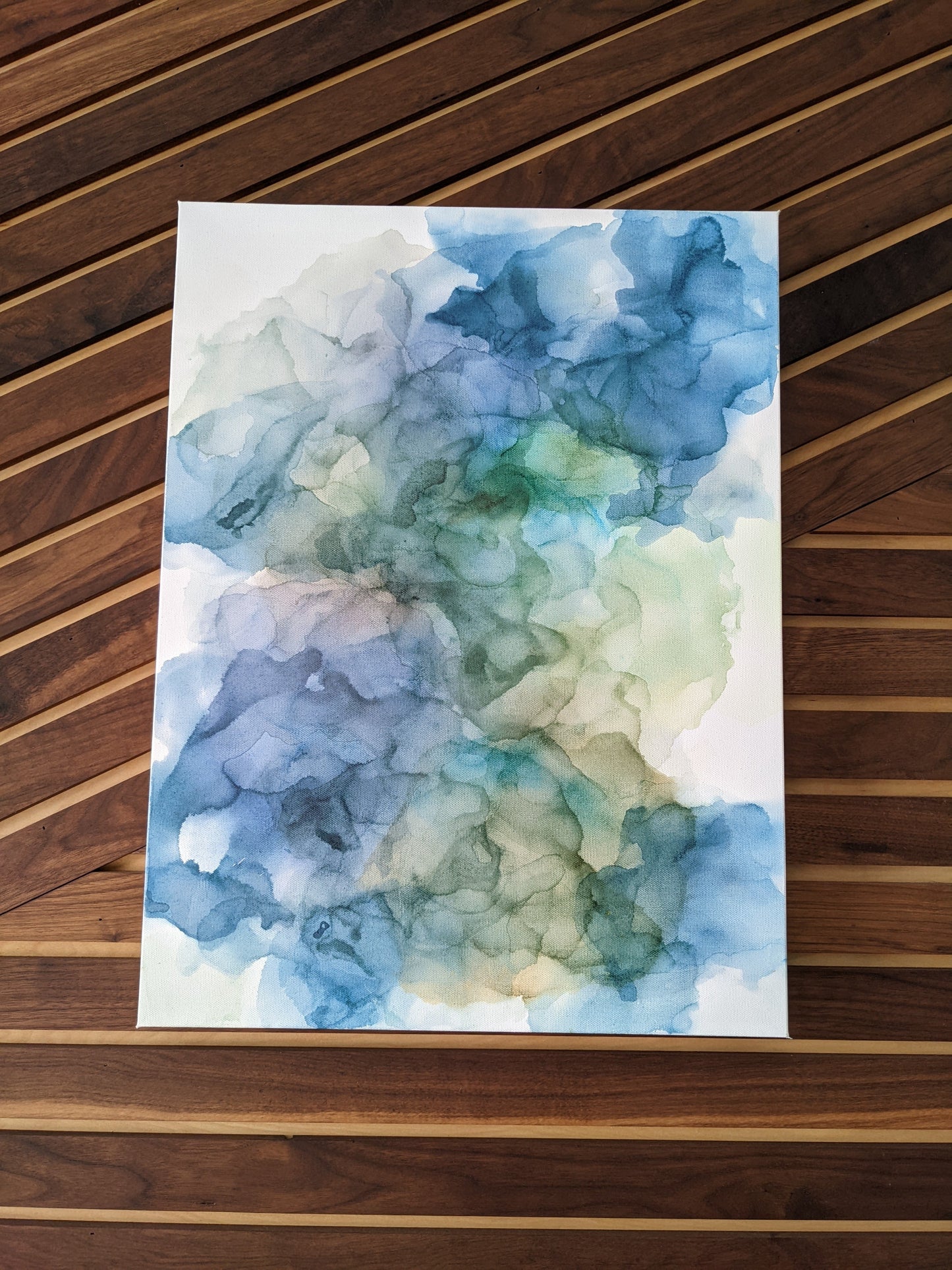 Zoomed in shot of canvas shown against a wood slat wall.