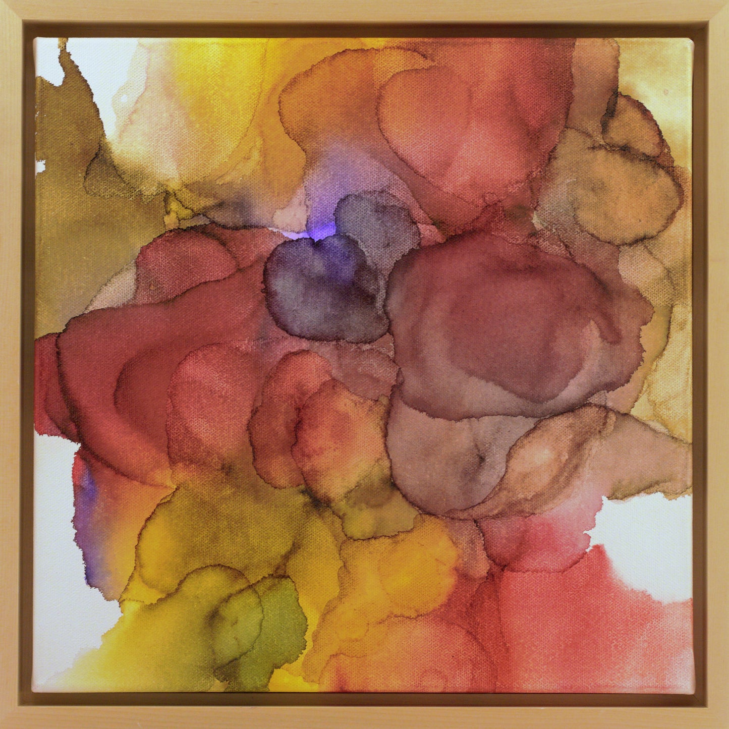 Cropped view of Abundance in a light maple float frame.