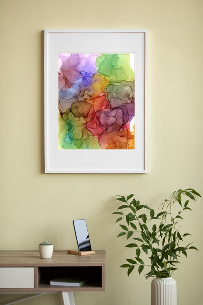 Digital mockup of a living room with Surrounded By Abundance framed in white hung on a pale yellow wall with a short wooden table and greenery in a cream vase below. 