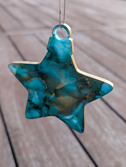 Star-shaped turquoise ornament on a wooden surface