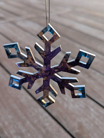 Decorative snowflake ornament on a wooden surface